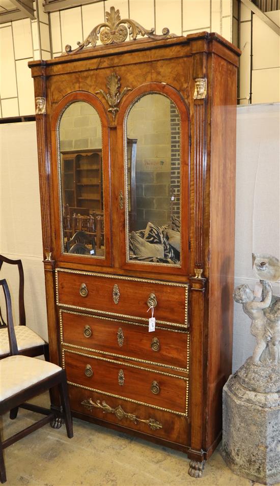 A French Empire style walnut and mahogany cabinet fitted mirror doors over three long drawers with gilt metal mounts made up, width 10